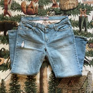 American Eagle light wash jeans with pink floral details